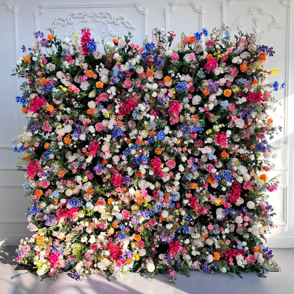 Vibrant floral wall with diverse colorful flowers.